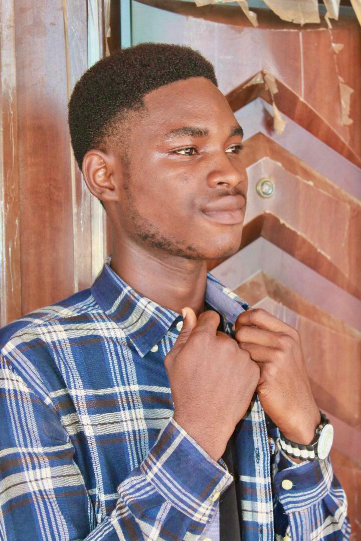 Miracle Aneke in a formal outfit-professional photo for biography use